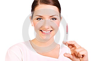 Smiling nurse with a syringe of blood