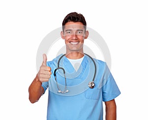 Smiling nurse in uniform gesturing positive sign