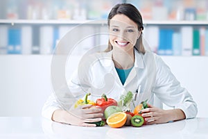 Smiling nutritionist in her office