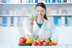 Smiling nutritionist in her office