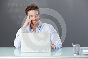 Smiling office worker with computer