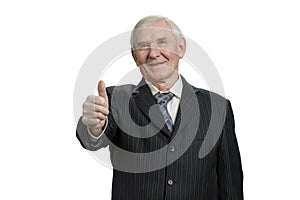 Smiling old businessman with thumb up.
