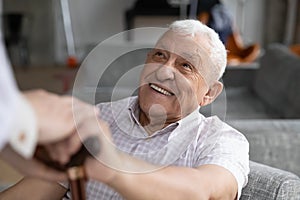 Smiling old male pensioner involved in rehabilitation procedure.