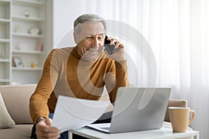 Smiling old man have business call while working from home
