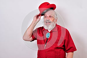 Smiling old man tips his red bowler hat