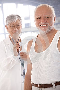 Smiling old man waiting for examination