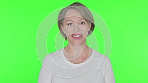 Smiling Old Woman on Green Background