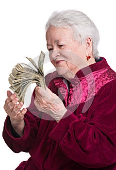 Smiling old woman holding money
