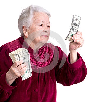Smiling old woman holding money