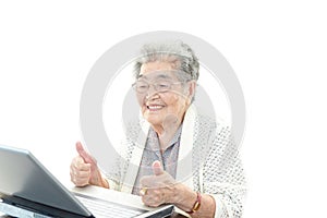 Smiling old woman with thumbs up