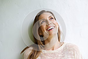 Smiling older woman looking up