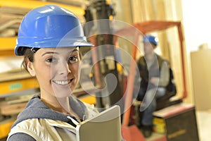 Smiling operator in warehouse working