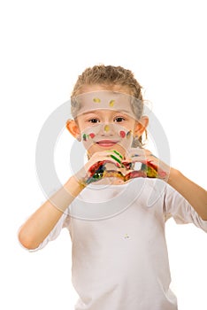 Smiling painted girl showing heart shape