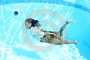 Smiling Papuan woman swimming in pool