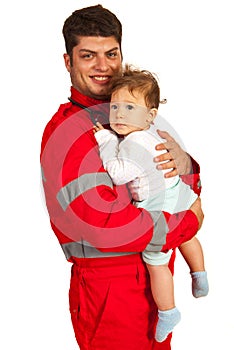 Smiling paramedic man holding baby