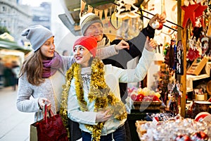 Smiling parents with daughter of Xmas market