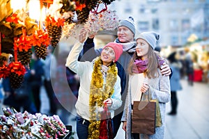 Smiling parents with daughter of Xmas market