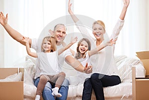 Smiling parents and two little girls at new home