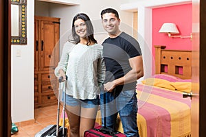 Smiling Partners Arrived With Baggage In Hotel Room