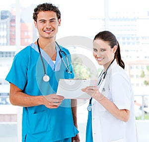 Smiling partners holding a patient diagnosis