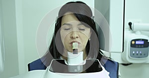 Smiling patient woman making dental X-ray examinations