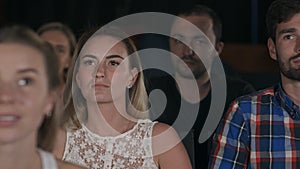 Smiling people in movie theater