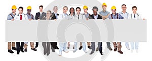 Smiling people with various occupations holding blank billboard