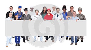 Smiling people with various occupations holding blank billboard