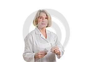 Smiling pharmacist with tablets