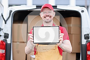 Smiling portrait of courier with tablet app for delivering orders