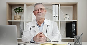 Smiling Positive Doctor At Work Looking at Camera