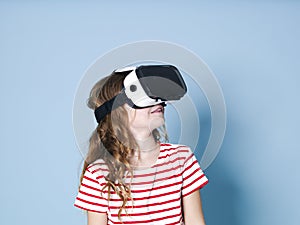 Smiling positive girl wearing virtual reality glasses goggles headset, vr box. connection, modern, new generation, concept.