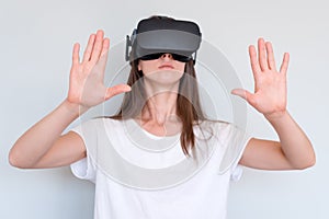 Smiling positive woman wearing virtual reality goggles headset, vr box. Connection, technology, new generation, progress