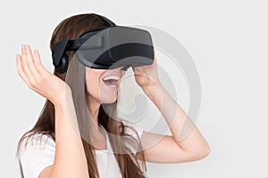 Smiling positive woman wearing virtual reality goggles headset, vr box. Connection, technology, new generation, progress