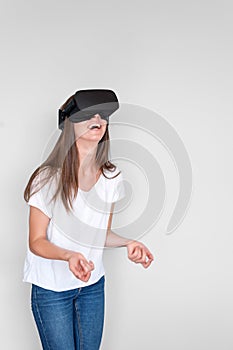 Smiling positive woman wearing virtual reality goggles headset, vr box. Connection, technology, new generation, progress concept.