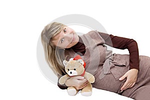 Smiling pregnant with bear