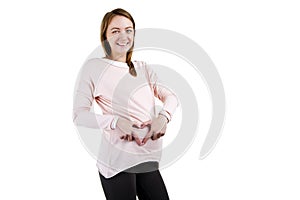 Smiling pregnant woman - isolated over a white background