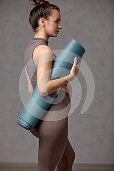 Smiling pregnant woman in sportswear ready for morning gymnastics or exercise. Happy young female follow healthy