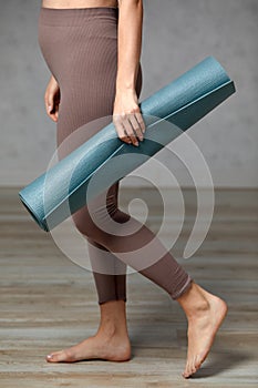 Smiling pregnant woman in sportswear ready for morning gymnastics or exercise. Happy young female follow healthy