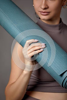 Smiling pregnant woman in sportswear ready for morning gymnastics or exercise. Happy young female follow healthy