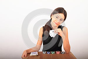 Smiling pretty girl - kid playing poker with money