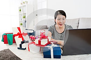 Smiling pretty woman using mobile laptop computer