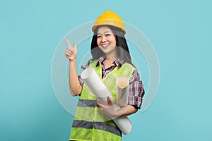 Smiling professional asian female architect and pointing hand left with carry blueprint