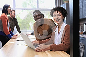 Smiling professional business leaders and employees group team portrait