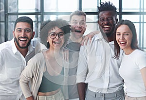 Smiling professional business leaders and employees group team portrait