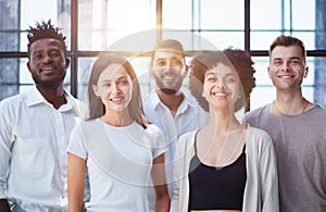 Smiling professional business leaders and employees group team portrait