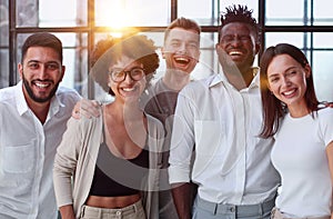 Smiling professional business leaders and employees group team portrait