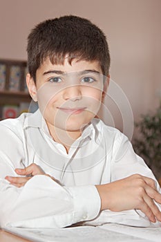 Smiling pupil with a copybook