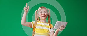 Smiling pupil with tablet PC got idea on green background