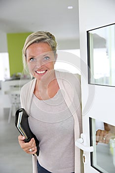 Smiling real-estate agent woman